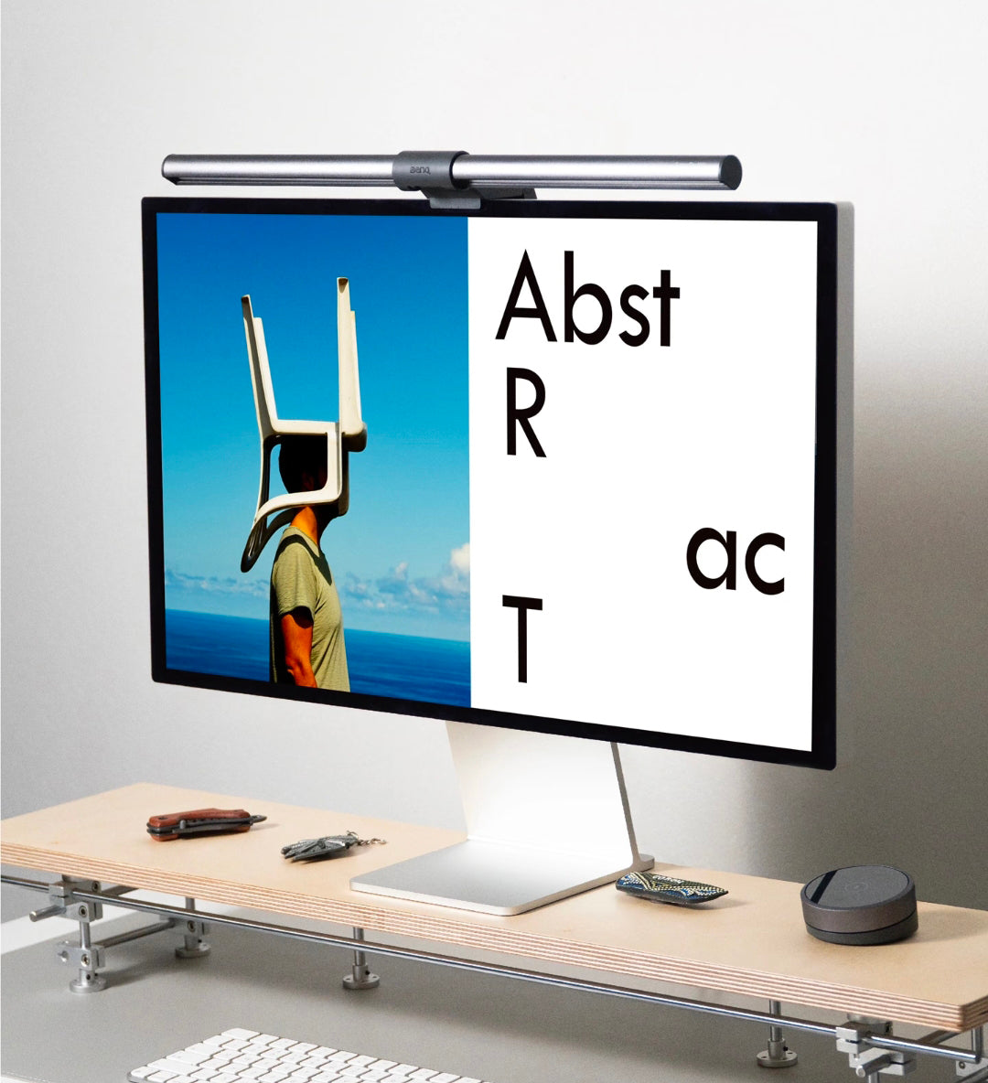 HushLume custom acrylic monitor riser - modern desk with artistic screen display