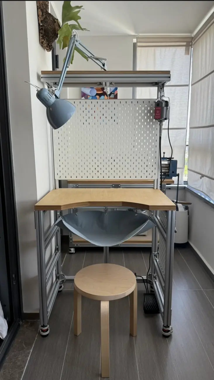 Custom modular aluminum-profile desk designed for a specific workspace.
