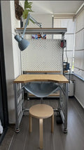 Custom modular aluminum-profile desk designed for a specific workspace.