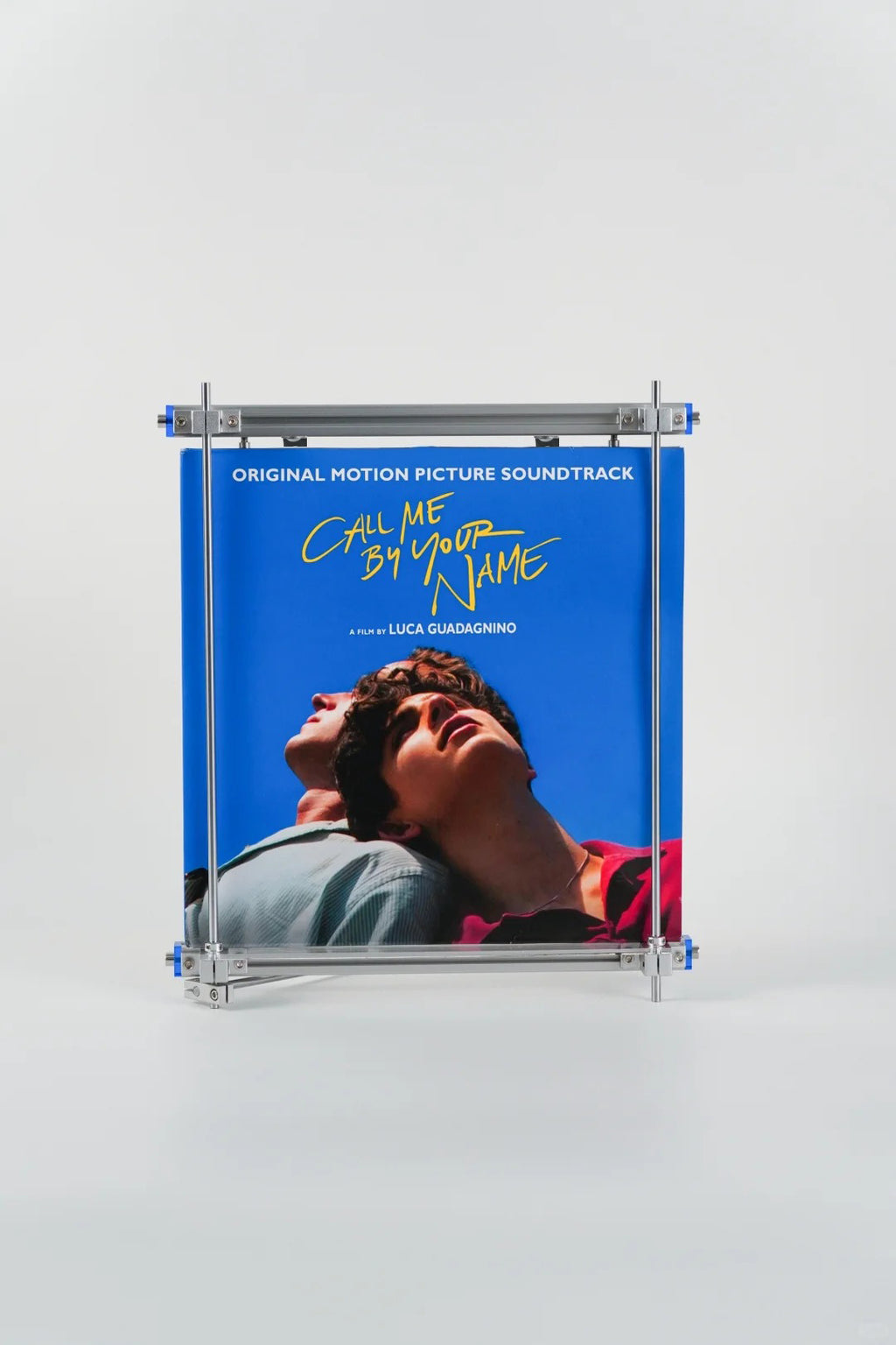 HushLume cyberpunk neon edition vinyl record stand displaying a blue vinyl album cover on a minimalist white background
