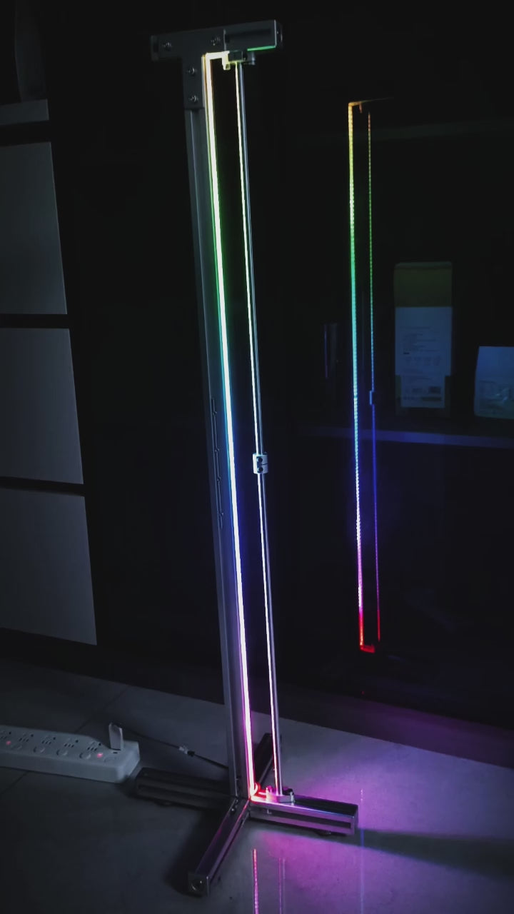 HushLume RGB corner floor lamp glowing in a dark room — multicolor ambient lighting effect